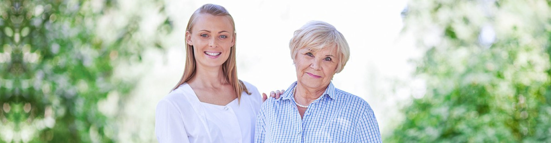 caregiver and senior woman smiling outdoor